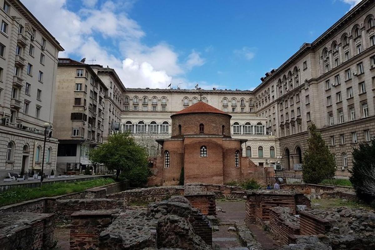 a large building with a brick tower in front of it