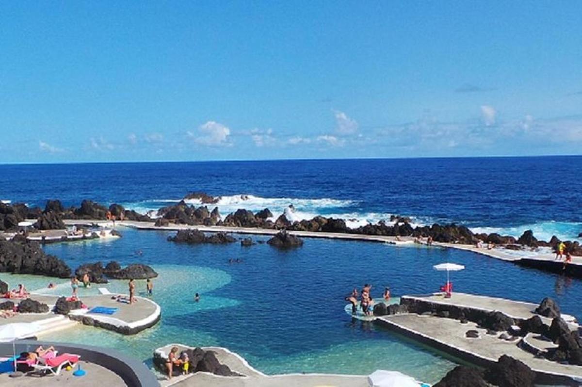 a swimming pool in the middle of the ocean