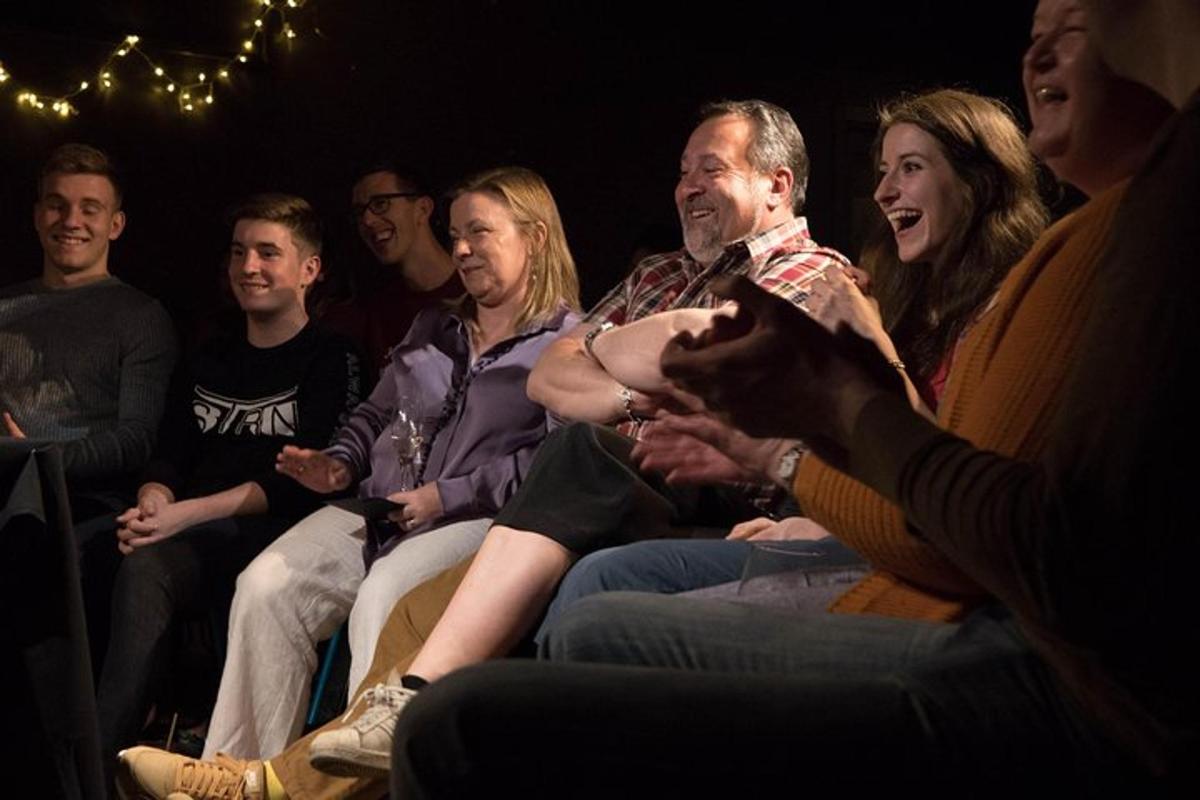 a group of people sitting in a crowd