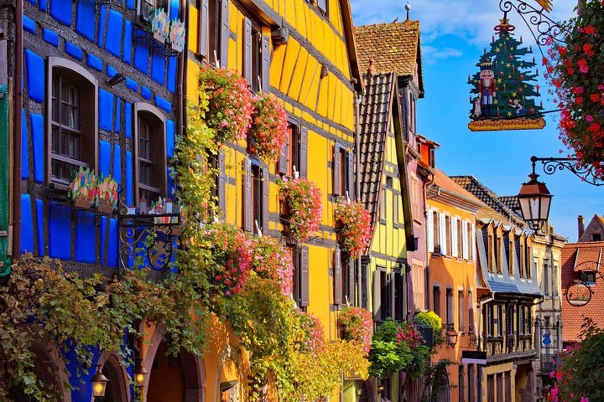 a street with colorful buildings and a christmas tree