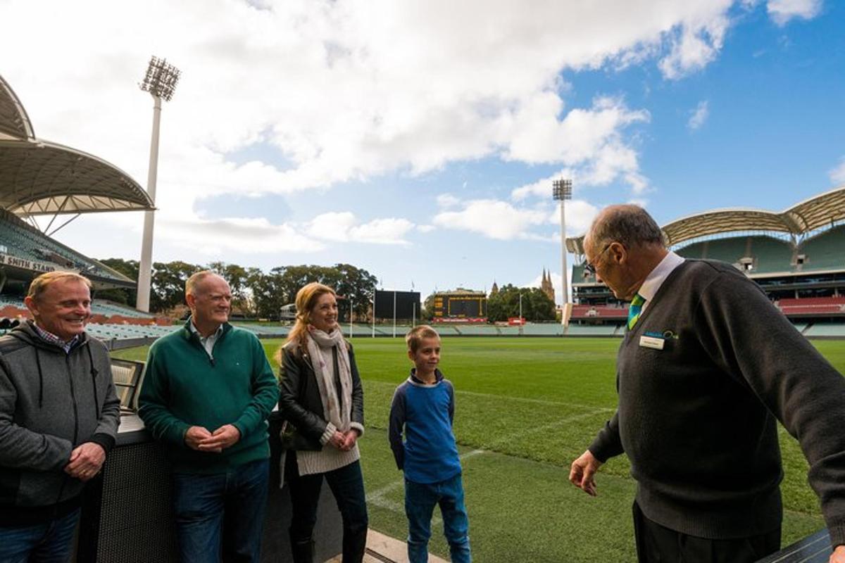 a group of people standing in front of a soccer field