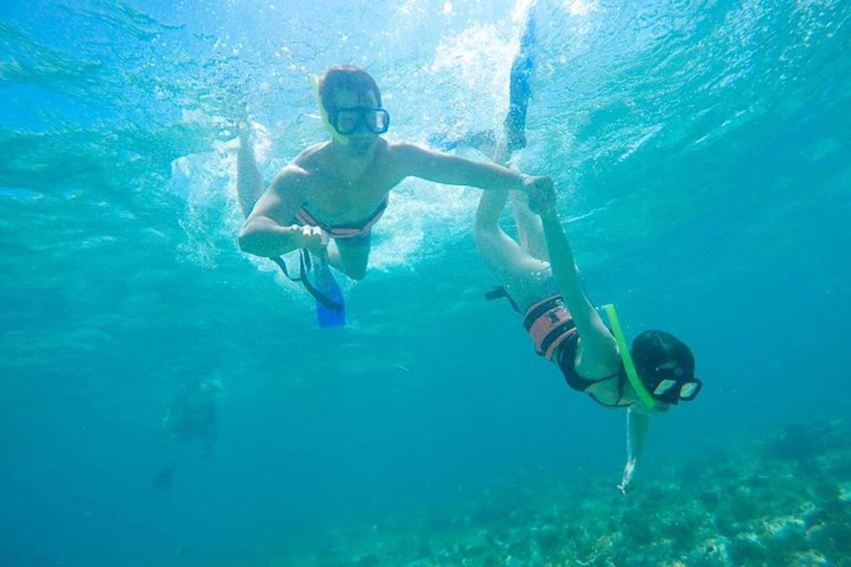 two young boys in the water in the ocean