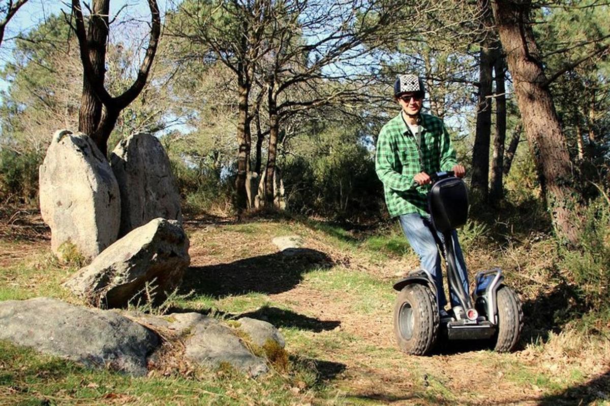 a man riding a segway in a field