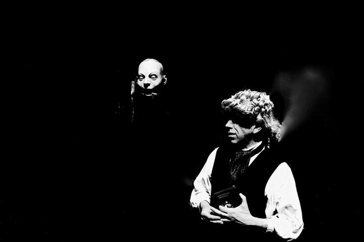 two men standing next to each other on a stage