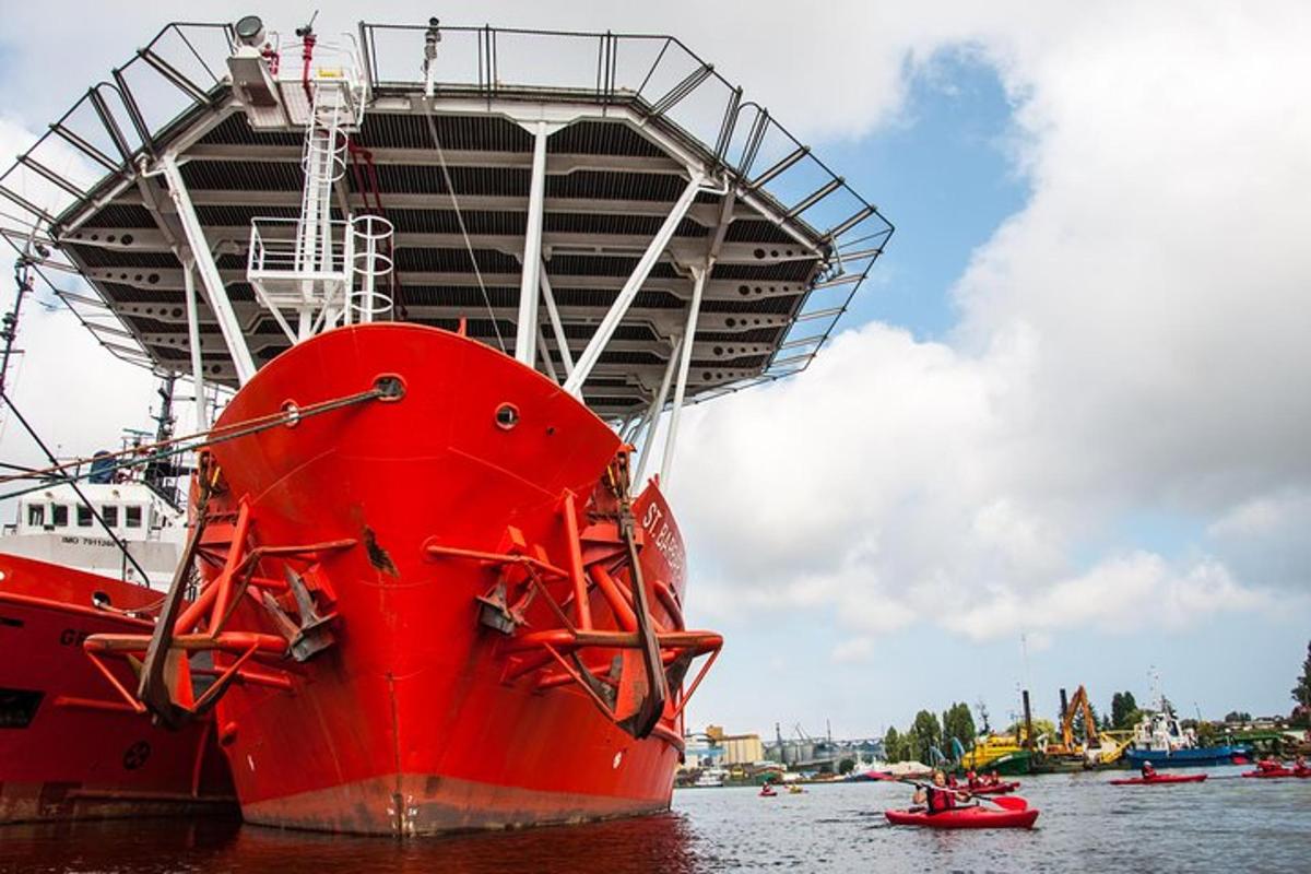 a large red boat sitting in the water