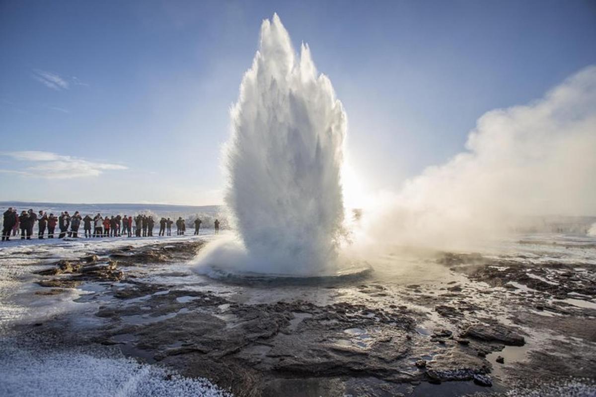 a geyser is spewing water on a beach