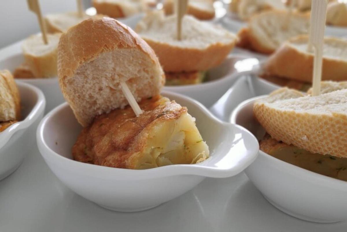 a sandwich in a bowl with a toothpick in it