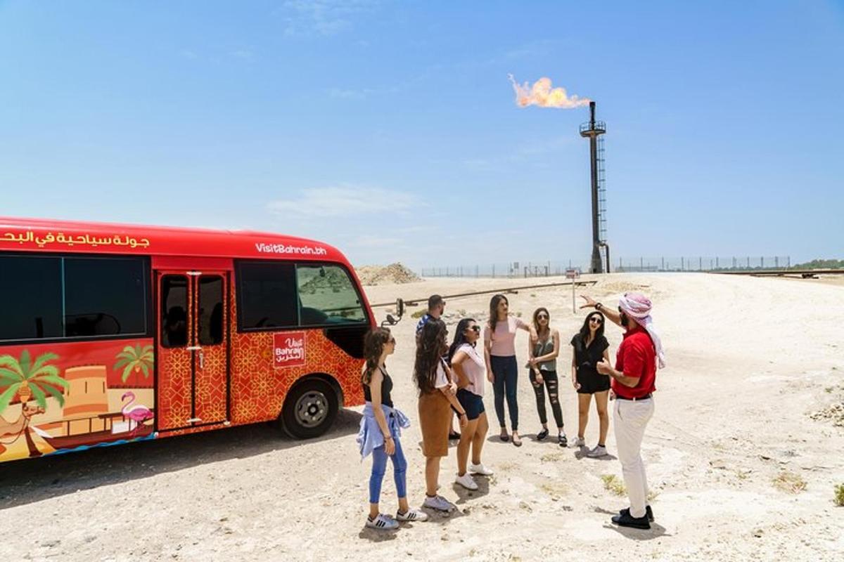 a group of people standing in front of a bus