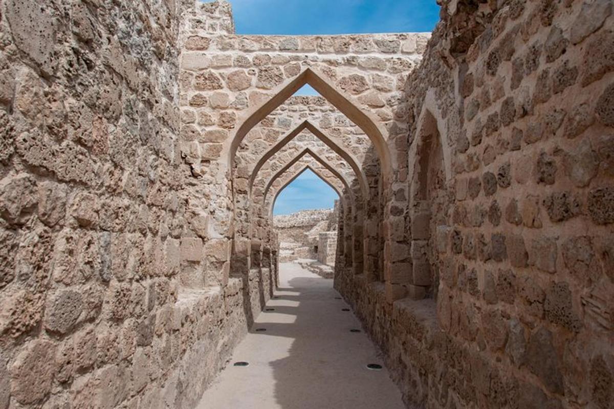 an alley with an archway in a stone building