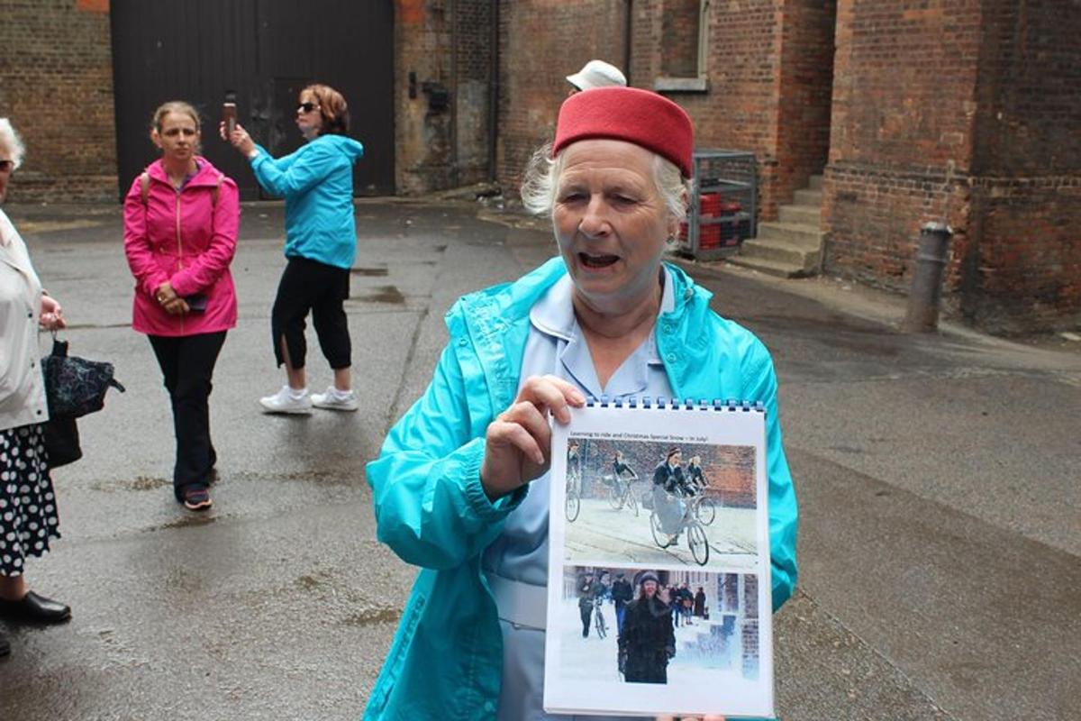 an older woman holding a picture of a man