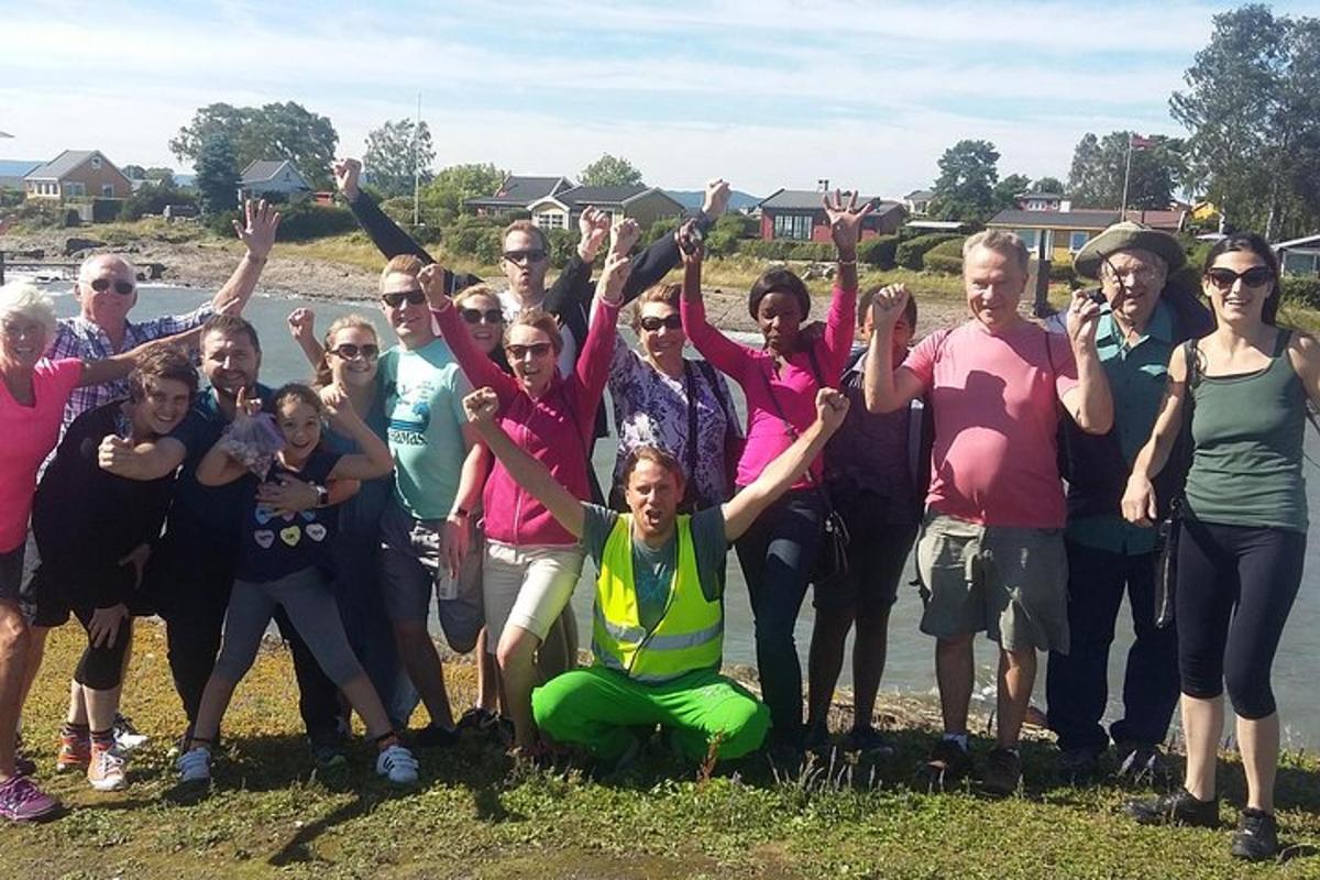 a group of people posing for a picture with their hands in the air