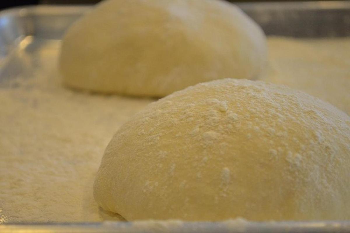 two rolls of dough sitting on a pan