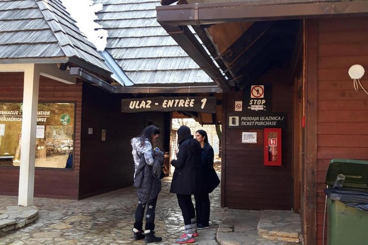 a group of people standing outside of a store