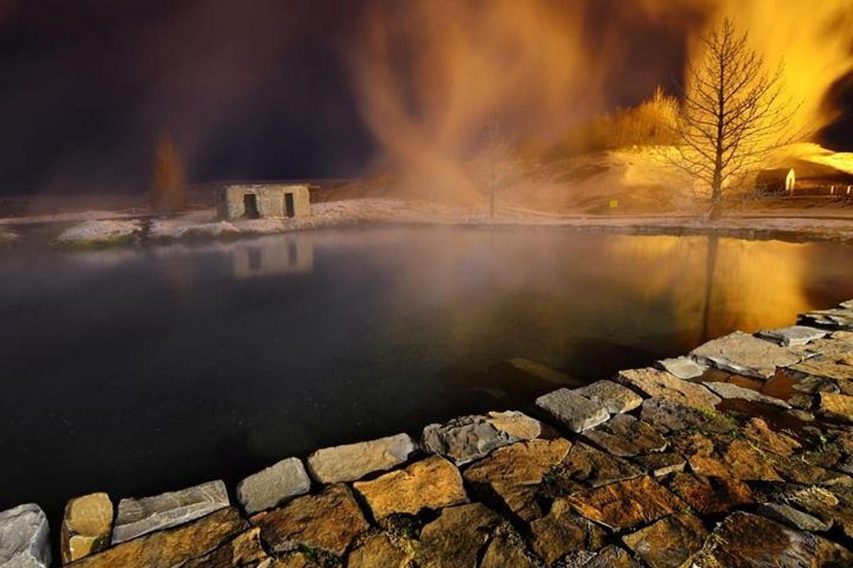 a body of water with a pile of smoke