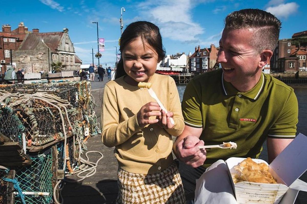 a man and a woman eating food with chopsticks