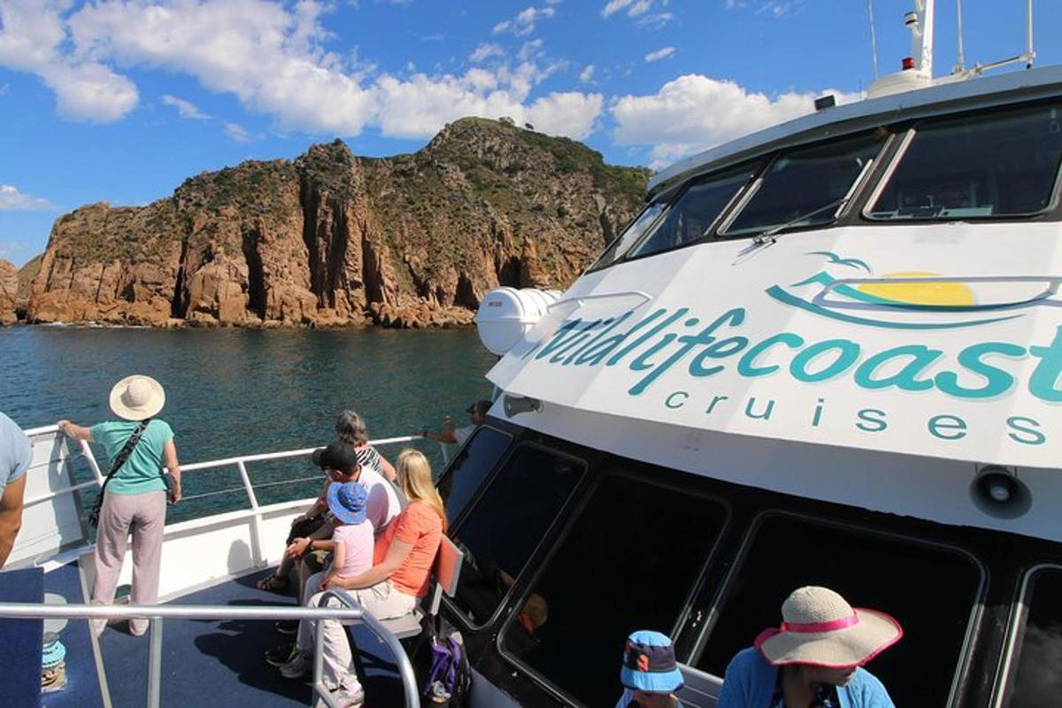 a group of people on a boat in the water