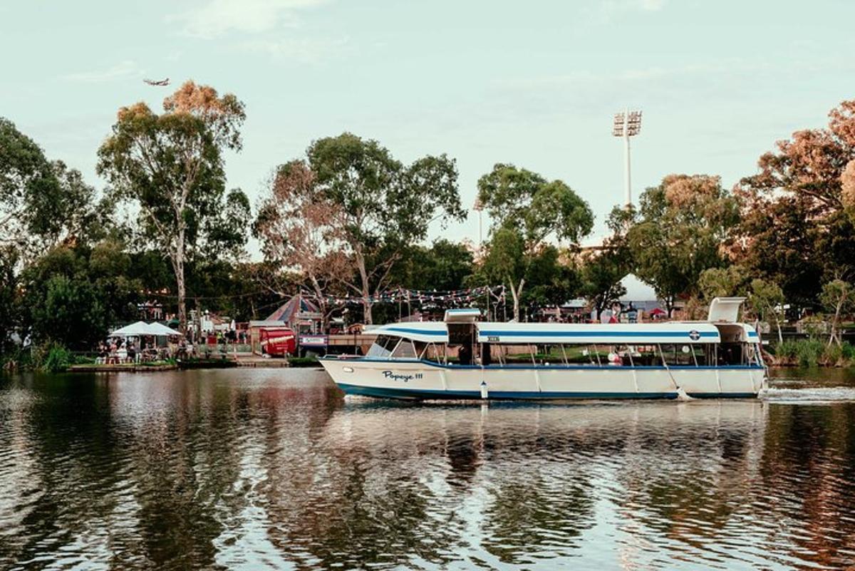 a boat on a river with trees in the background