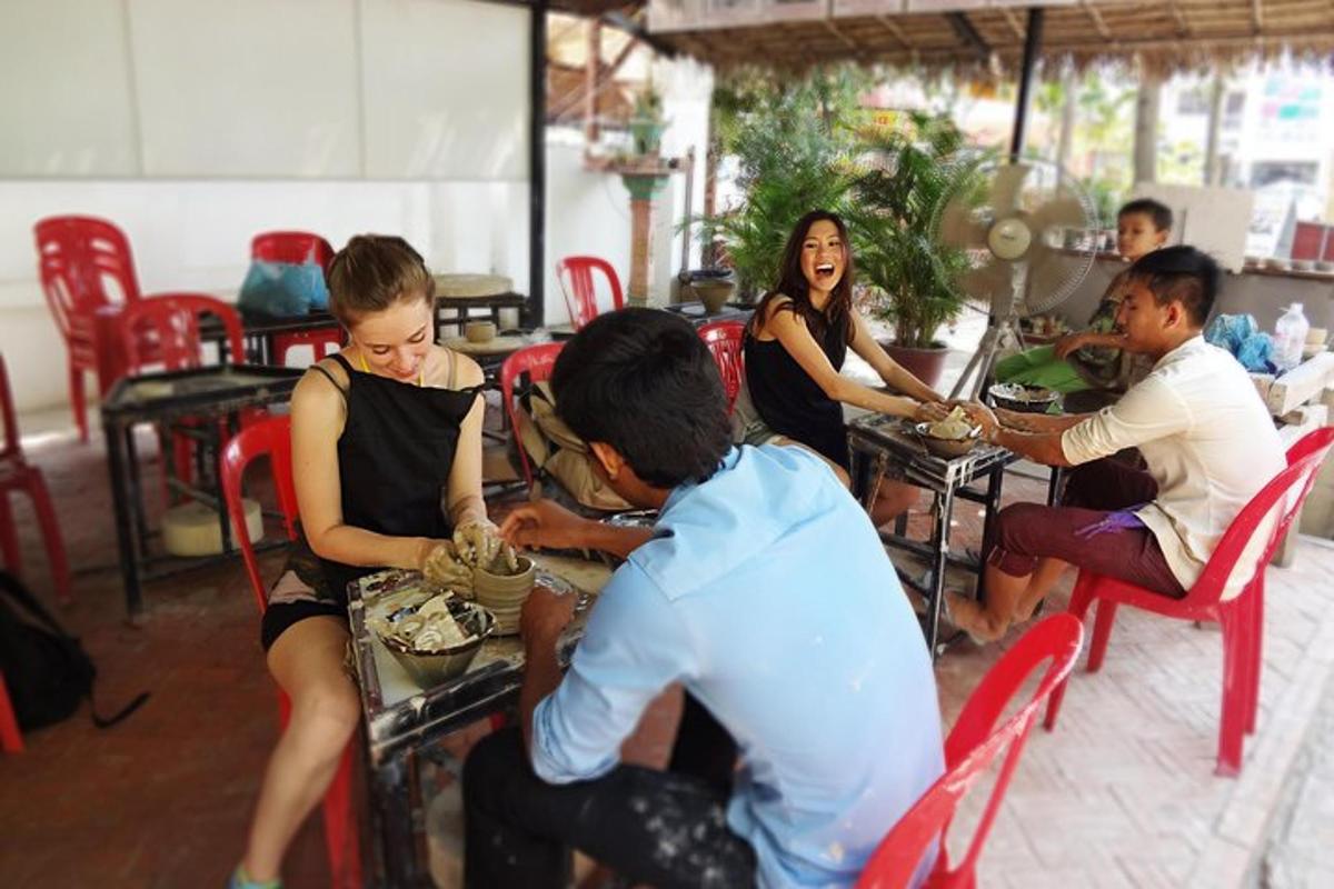 a group of people sitting at a table eating food