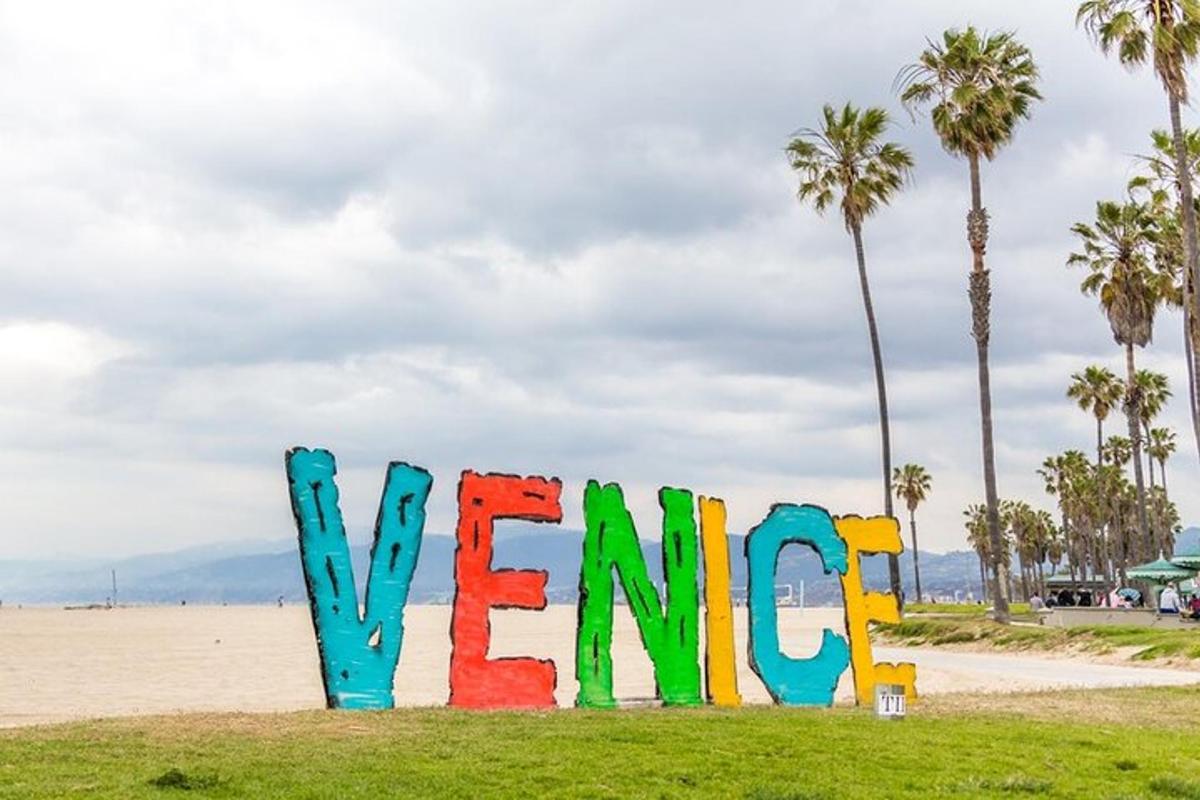 a sign that says welcome on the beach