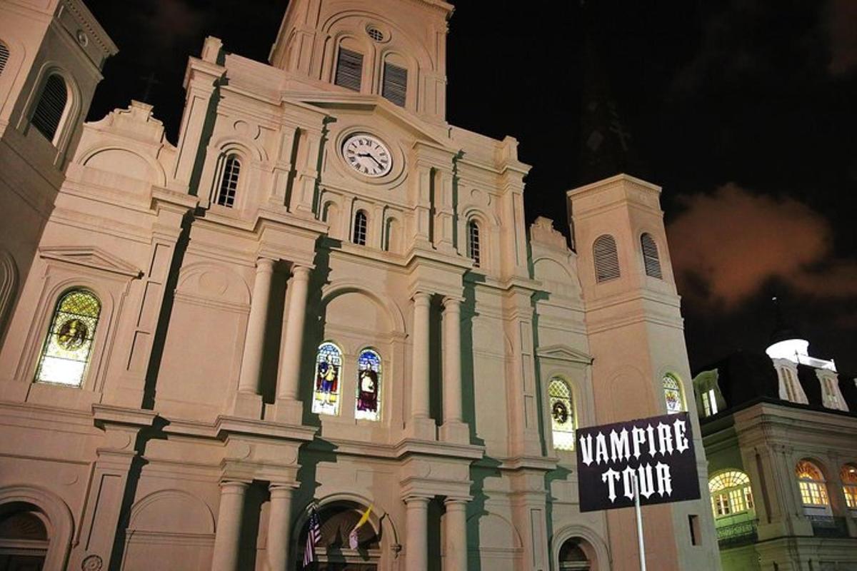 a large building with a clock tower at night