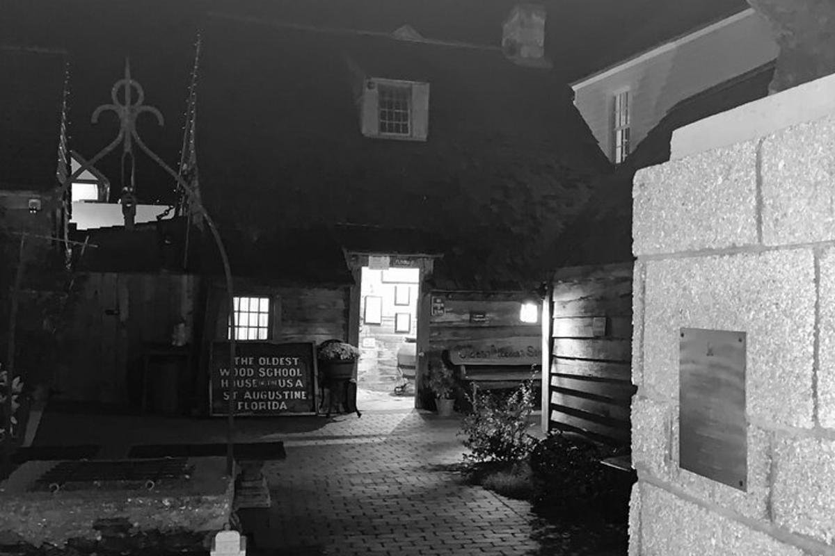 a black and white photo of a room with a building