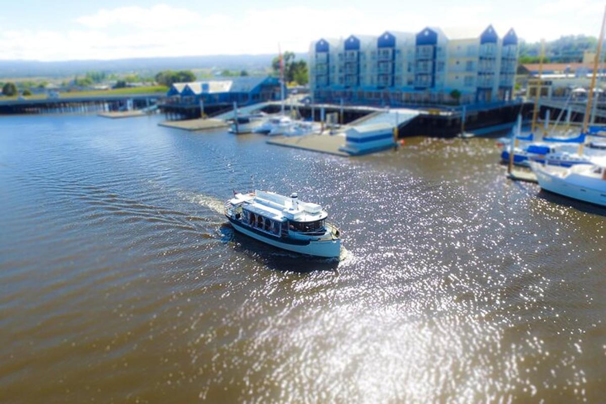 a small boat in the water in a harbor
