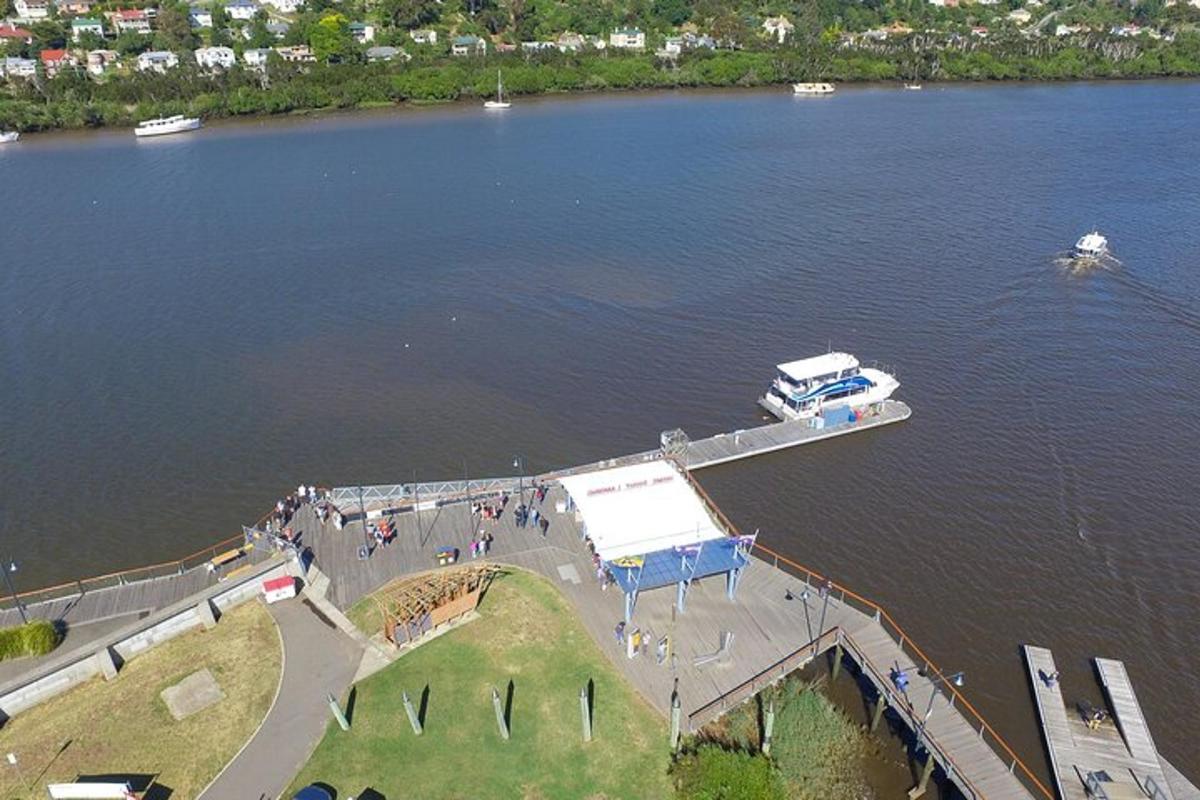 an aerial view of a boat dock on a lake