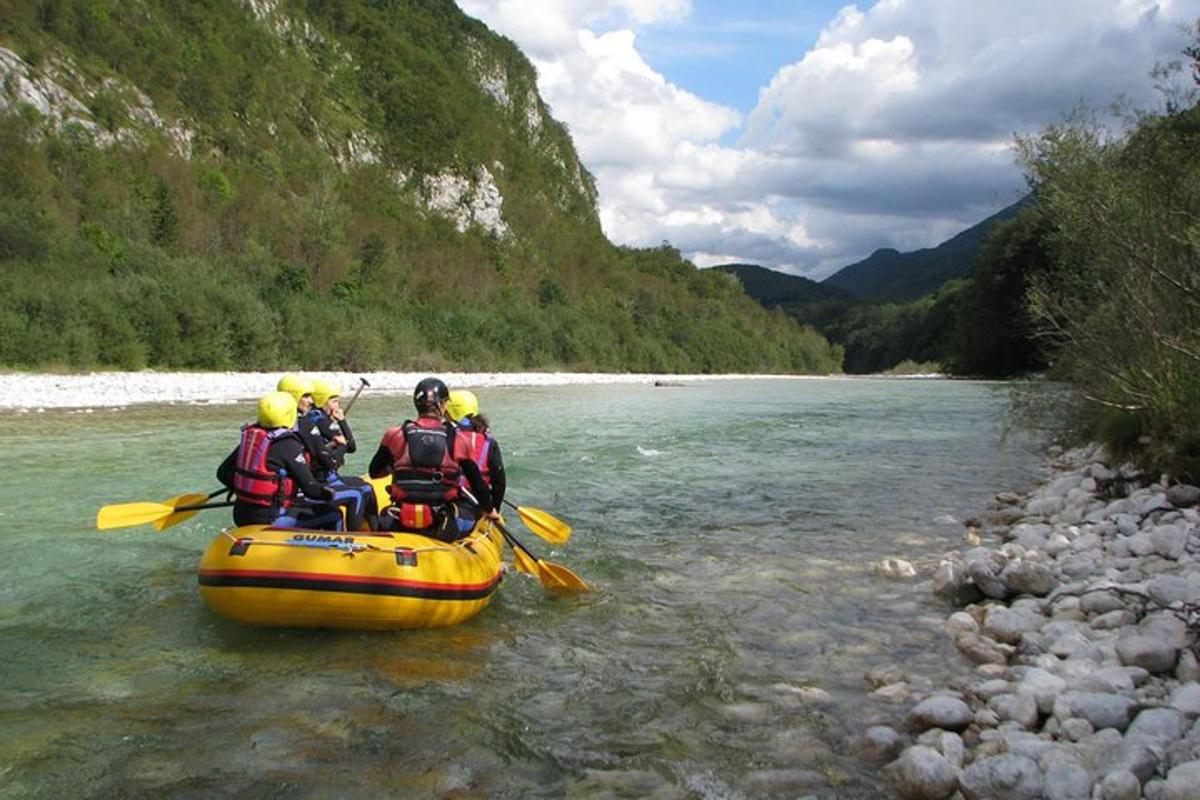 a group of people in a raft on a river