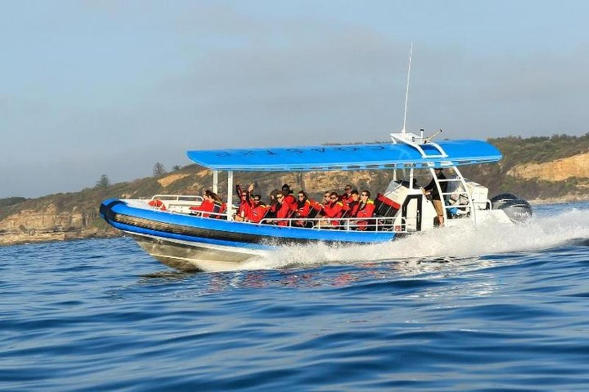 a group of people in a boat on the water