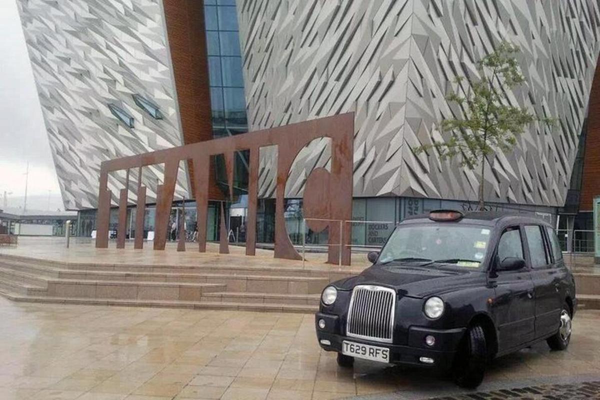 a black car parked in front of a building