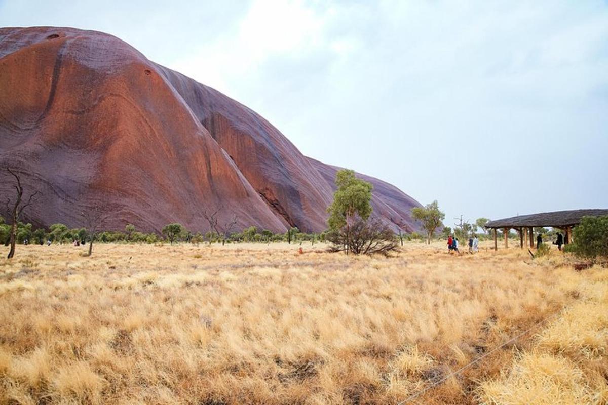 a large rock in the middle of a field