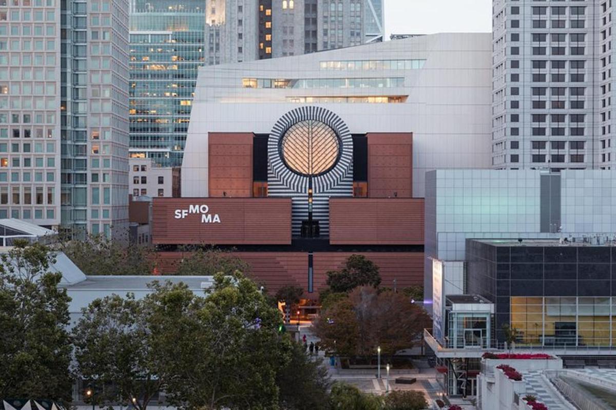 a large building with a sign on it in a city