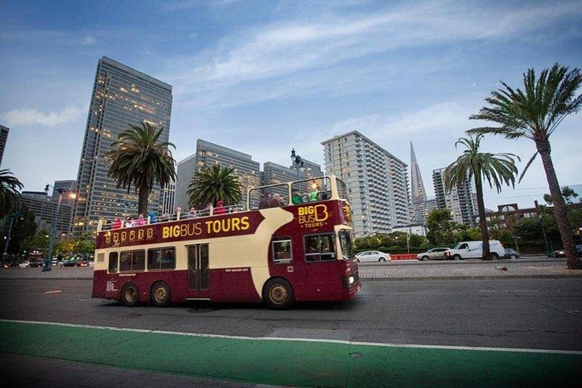 a double decker bus driving down a city street