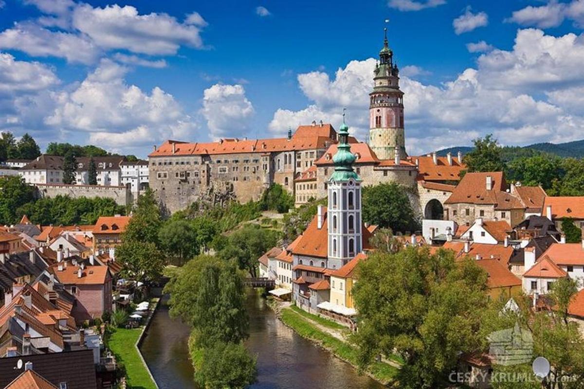 a city with a castle and a river with buildings