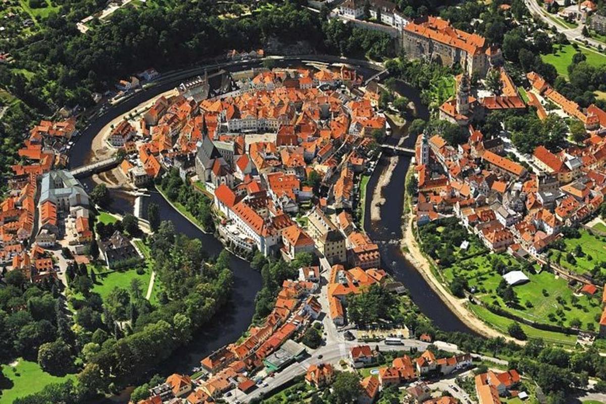 an overhead view of a city with a river