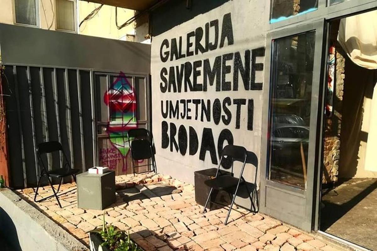 a store with a sign on the side of a building