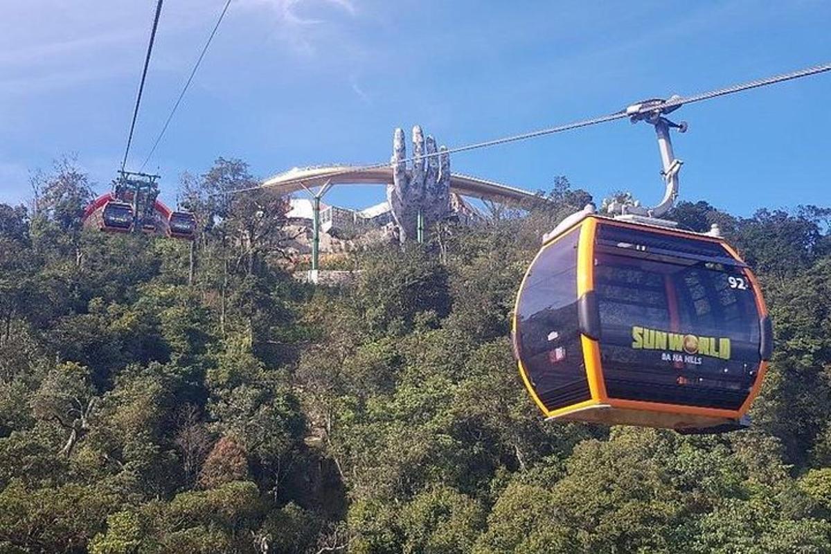 a group of gondolas flying over a mountain