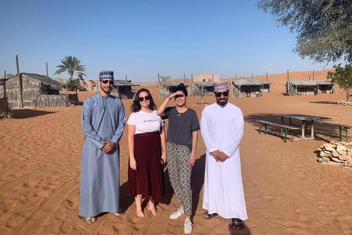 a group of people posing for a picture in the desert