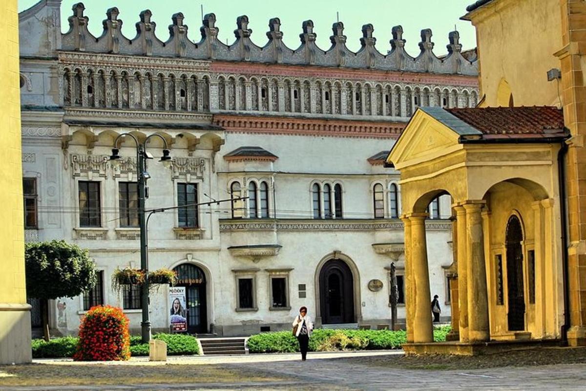 a woman standing in front of a large building