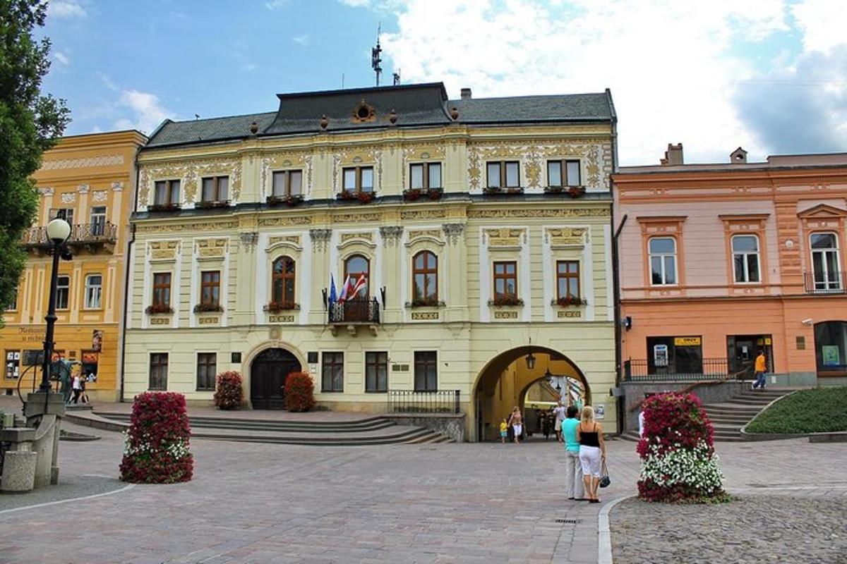 a large building with people standing in front of it