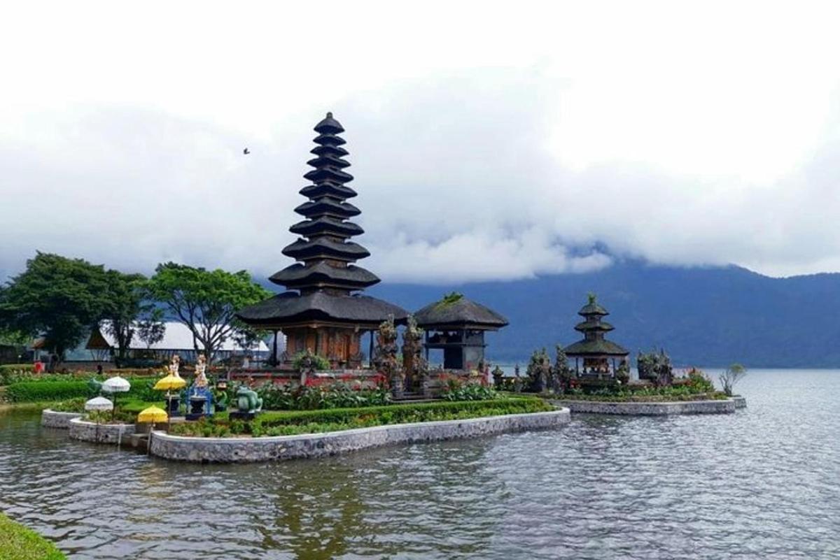 a group of pagodas in the middle of a lake