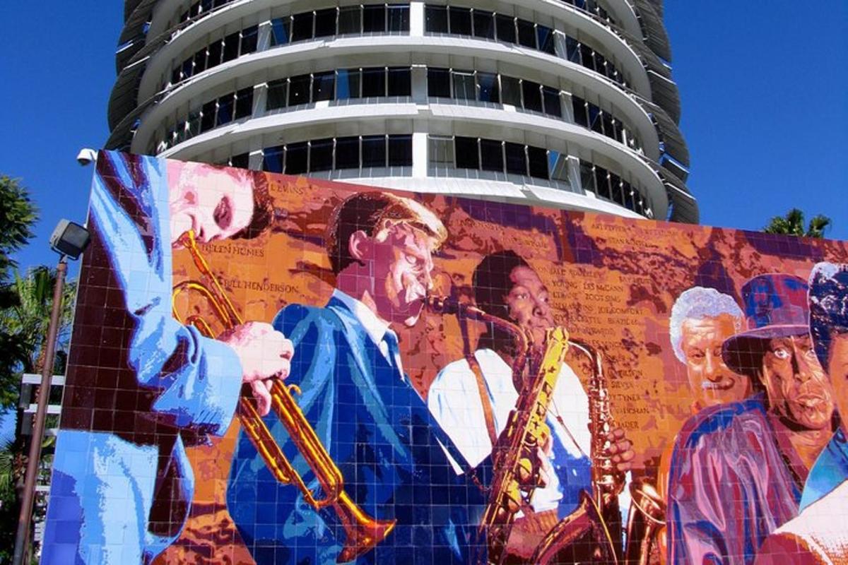 a mural on the side of a building with musicians