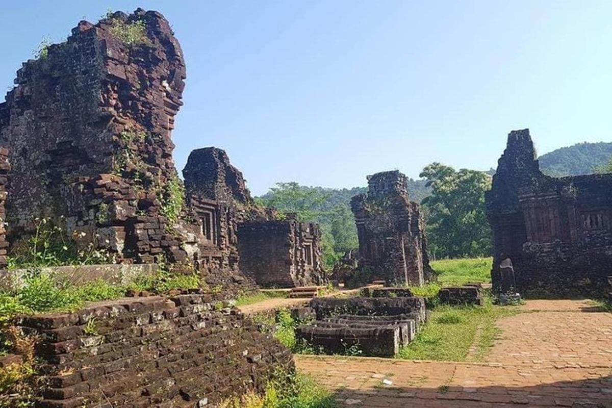 a group of stone ruins in a field