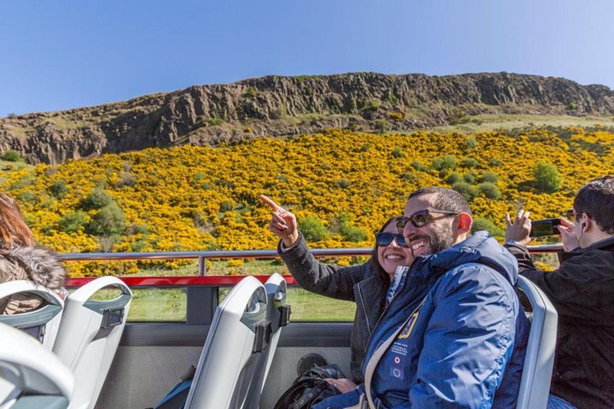 a man and a woman riding on a bus