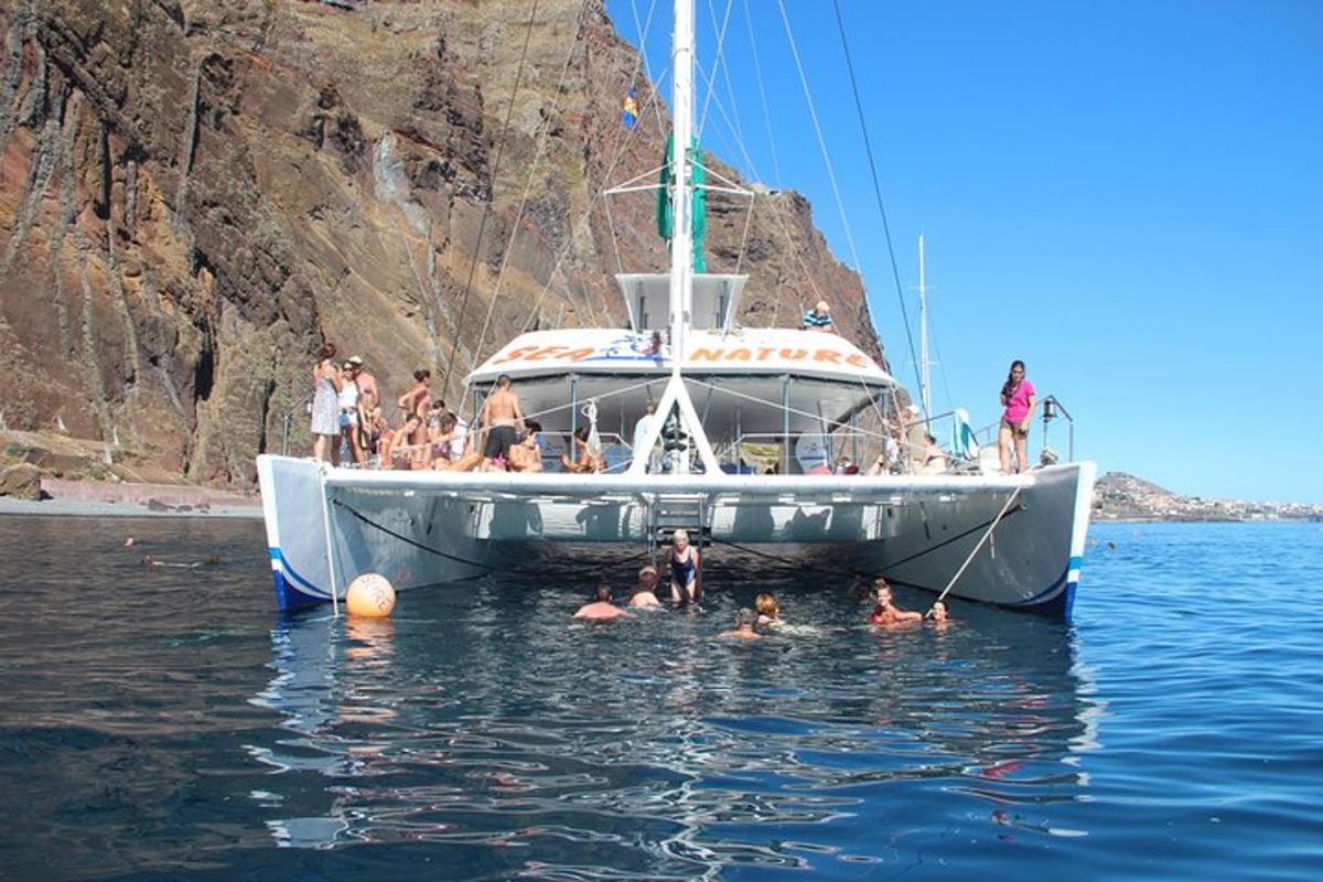 a group of people on a boat in the water