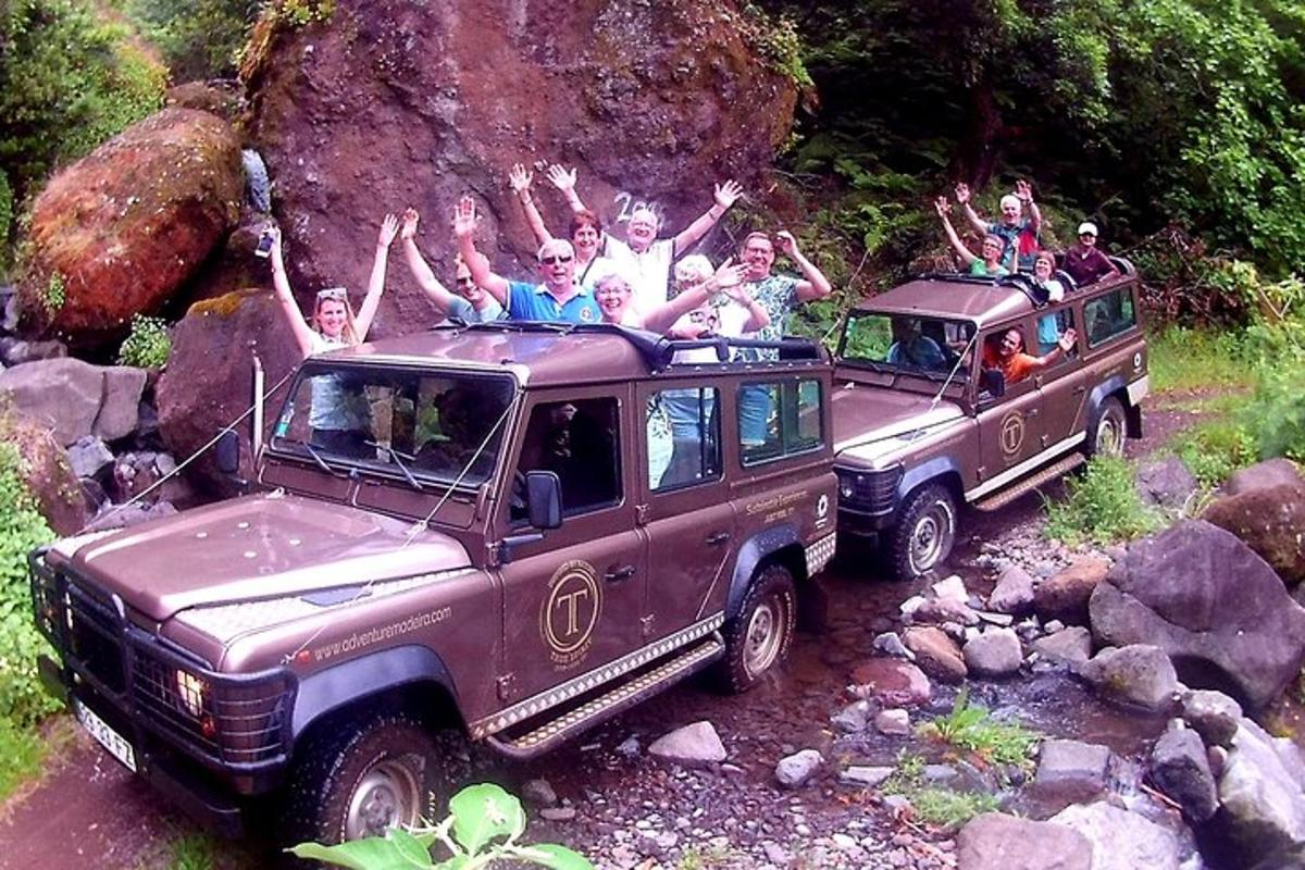 a group of people riding on the roof of a vehicle