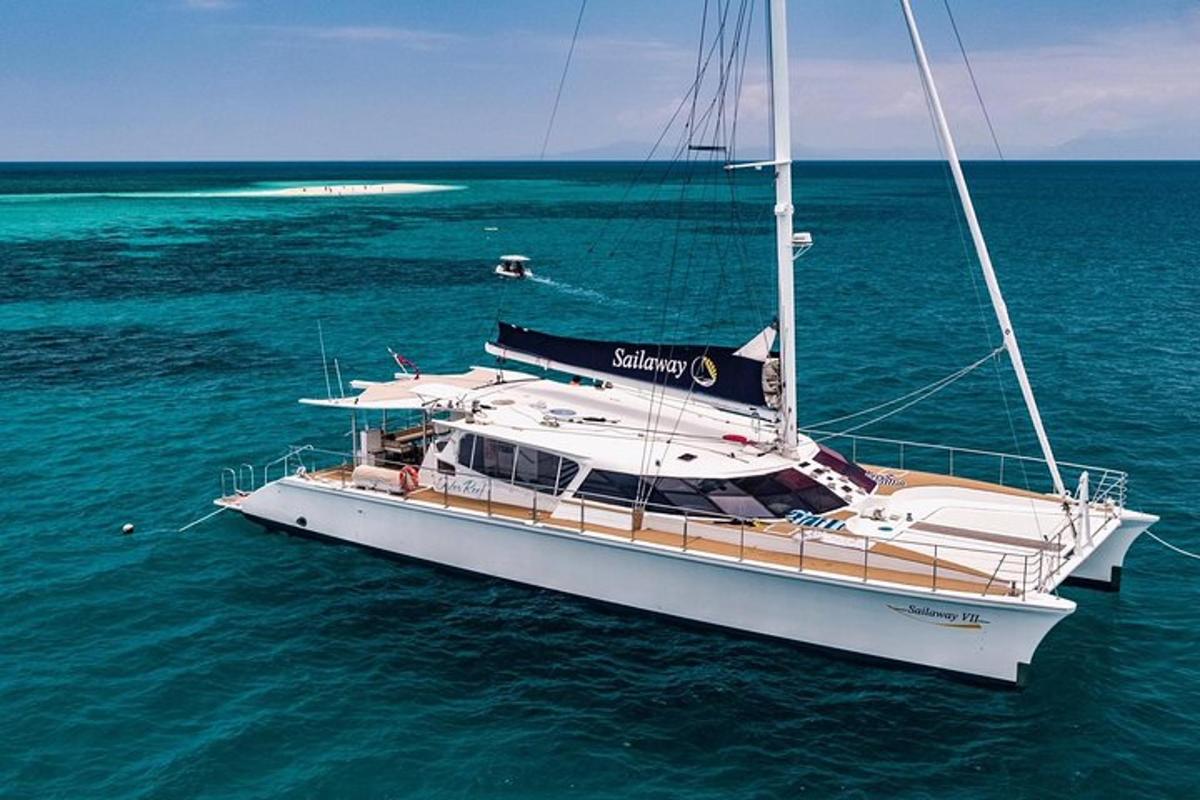 a sailboat floating in the water in the ocean