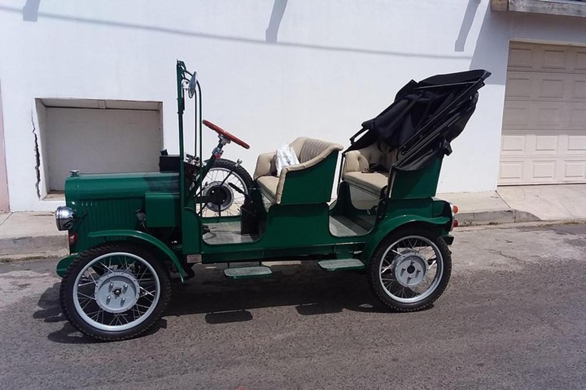 a green golf cart with a bike in it