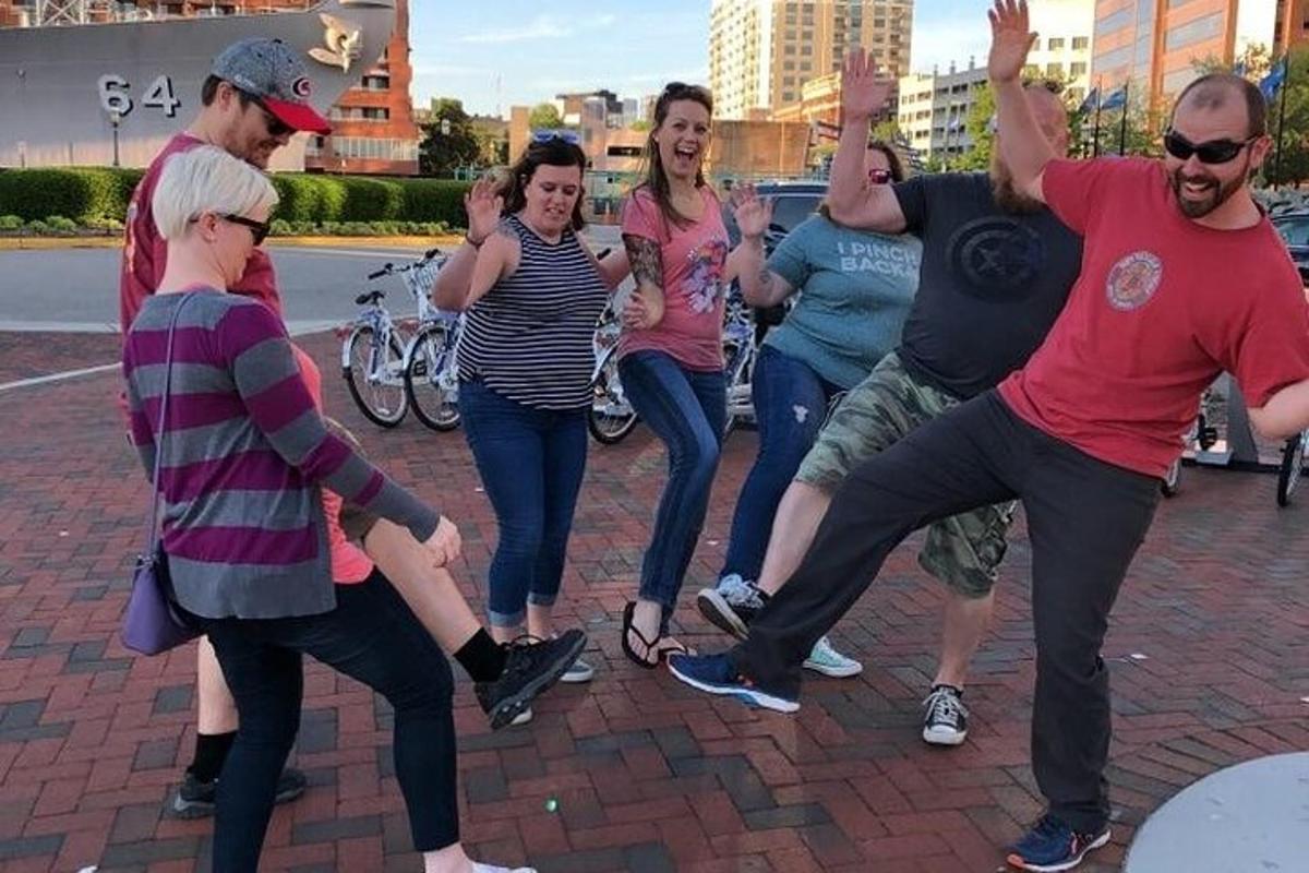 a group of people are dancing on a street