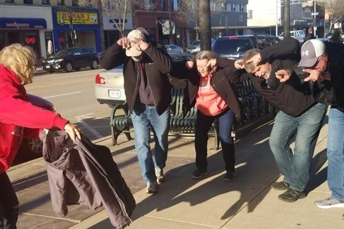 a group of people walking down the street